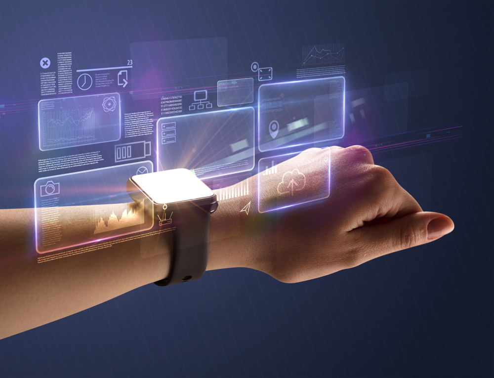 Female hand wearing smartwatch with statement labels around and dark background